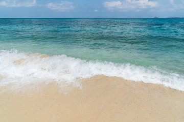 Beautiful seascape with white sand and wave at tropical beach