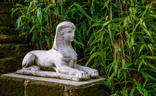 Traditional Egyptian Decorations, White Stone Sphinx Sculpture In A Garden