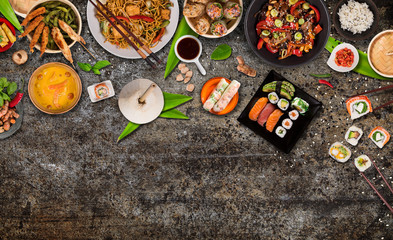 Asian food background with various ingredients on rustic stone background , top view.