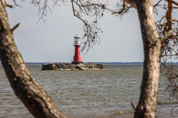 Wall Mural - In Lithuania, Pervalka lighthouse stands in the middle of the sea