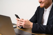 © luismolinero - Businessman in a office with mobile