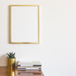 © mallmo - Stylish desk with gold supplies and frame mockup.