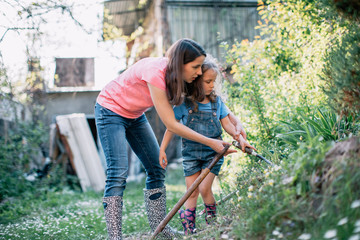 Mother and daughter working in the garden