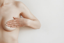 Closeup Cropped Portrait Young Woman With Breast Pain Touching Chest Colored Isolated On Background