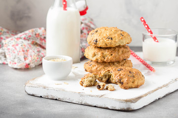 Wall Mural - Homemade oatmeal cookies with chocolate and banana, milk in a glass with a tube. Delicious dessert, Breakfast (lunch), healthy food, pastries for children