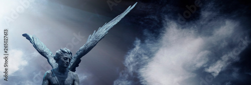 Fotografía Guardian angel statue in light as a symbol of strength, truth and faith