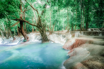 Jangle landscape with turquoise water of Kuang Si waterfall. Laos