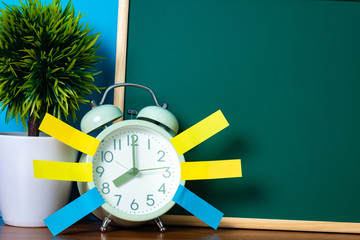 Wall Mural - Note paper sticky and vintage alarm clock and blank green chalkboard on table with copy space for add text notice something, list memo and schedule concept.