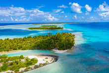 Drone Aerial Video Of Rangiroa Atoll Island Motu And Coral Reef In French Polynesia, Tahiti. Amazing Nature Landscape With Blue Lagoon And Pacific Ocean. Tropical Travel Paradise In Tuamotus Islands.