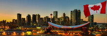 Canadian Flag In Front Of View Calgary City Skyline At Twilight Time, Alberta,Canada