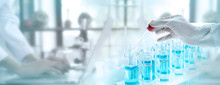 Test Tubes With Liquid In Laboratory, Doctor Hand Holding Dropper With Dripping Or Transparent Glass Pipette, Dropper For Instillation. Scientist Working In Laboratory. Banner For Website Advertising.