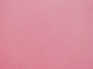 Texture of sweet pink cement walls for use as a background or wallpaper