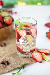 Wall Mural - healthy refreshing energy ice cold strawberries lemonade with lime