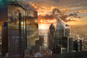 Canvas Print - City of London, UK. Skyline view of the famous financial bank district of London at golden sunset hour. View includes skyscrapers, office buildings and beautiful sky. 