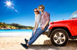 © magdal3na - Summer time on beach and two young people with red summer car.