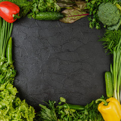 Healthy food. Vegetables  On a black wooden background