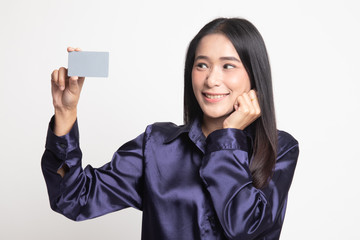 Happy young Asian woman with a blank card.