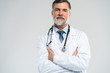© opolja - Cheerful mature doctor posing and smiling at camera, healthcare and medicine.