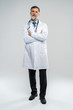 © opolja - Full body portrait of happy smiling doctor, isolated on white background.