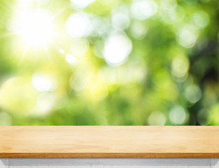 Aufkleber - Empty wood plank table top with blur tree in park with bokeh light at background,Mock up template for display of your design,Banner for advertise of product