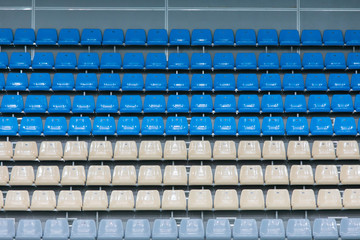 Empty Colored Plastic Seats On The Viewing Platform Of The Indoor Swimming Pool Complex Before The Competition