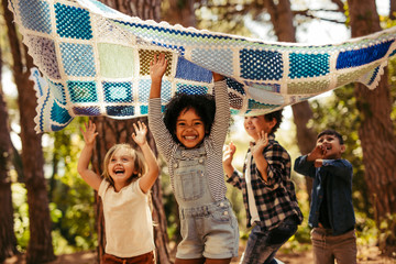 Kids having fun together in forest