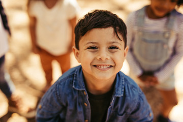 Poster - Cute boy smiling with friends