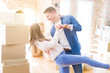 © Krakenimages.com - Beautiful young couple having fun dancing at new apartment, celebrating moving to a new home