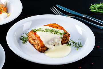 Sticker - lasagna on a white plate close up