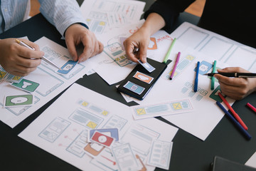 close-up ui ux designer meeting web smartphone layout application prototype