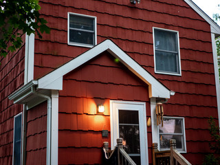 Wall Mural - red suburban house back door and facade at dusk