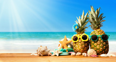 Pineapples with starfish on the tropical beach