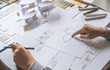 © Chaosamran_Studio - architect design working drawing sketch plans blueprints and making architectural construction model in architect studio