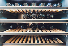 Storing Bottles Of Wine In Fridge. Alcoholic Card In Restaurant. Cooling And Preserving Wine.