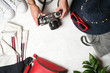 © Alexandr - Set of women's accessories for summer holidays with a retro camera on a light background top view copy space.
