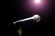 © Alik Mulikov - Microphone in a Black background. Music and concert concept.