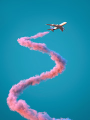 Wall Mural - airplane with spiral pink trail