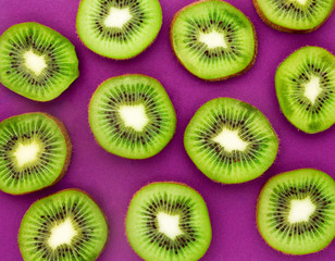 Wall Mural - Kiwi slices as bacground. Kiwi Fruit