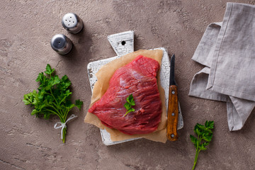 Raw meat on cutting board