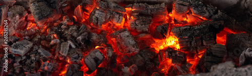 Fotografía Burning coals from a fire abstract background.