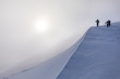 © Satu Juvonen - Hikers at top of steep snowy slope