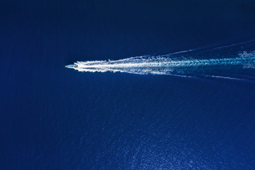 Wall Mural - yachts at the sea in bali, indonesia. aerial view of luxury floating boat on transparent turquoise w