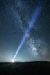 © Alvaro Sanchez/ADDICTIVE STOCK - Night sky with majestic Milky way and person with bright upward beam of light