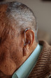 © Marcos Osorio/ADDICTIVE STOCK - Detail of a hearing aid in an old man