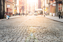 New York City - Cobblestone Street View In Soho With Bright Sunlight Background