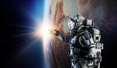 Wall Mural - astronaut in space on planet orbit.