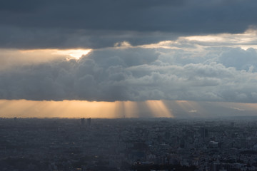 Poster - Aerial of Tokyo suburb cityscape with picturesque clouds and sunrays at sunset