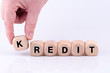 © HNFOTO - KREDIT aus einzelnen Buchstaben als Wort gelegt mit einer Hand