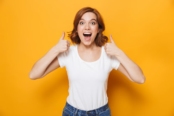 Wall Mural - Cheerful young girl wearing t-shirt standing