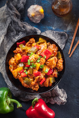 Wall Mural - Sweet and sour chicken with colorful bell pepper on a plate